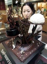 Some 100 diamonds encase a chocolate cake seen on display at a department store in Osaka. AP Photo/Kyodo News